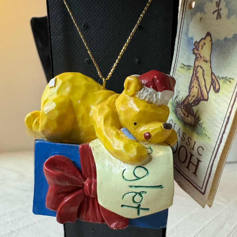 Disney Winnie the Pooh on top of a gift for piglet! Christmas Ornament